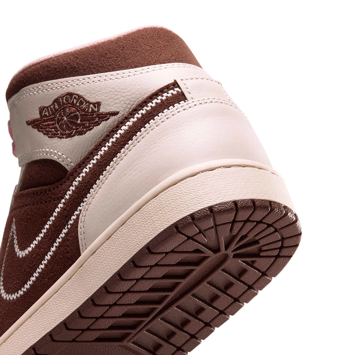 close-up of heel tab with Air Jordan wing logo and stitched swoosh, Cacao Wow/Rust Pink