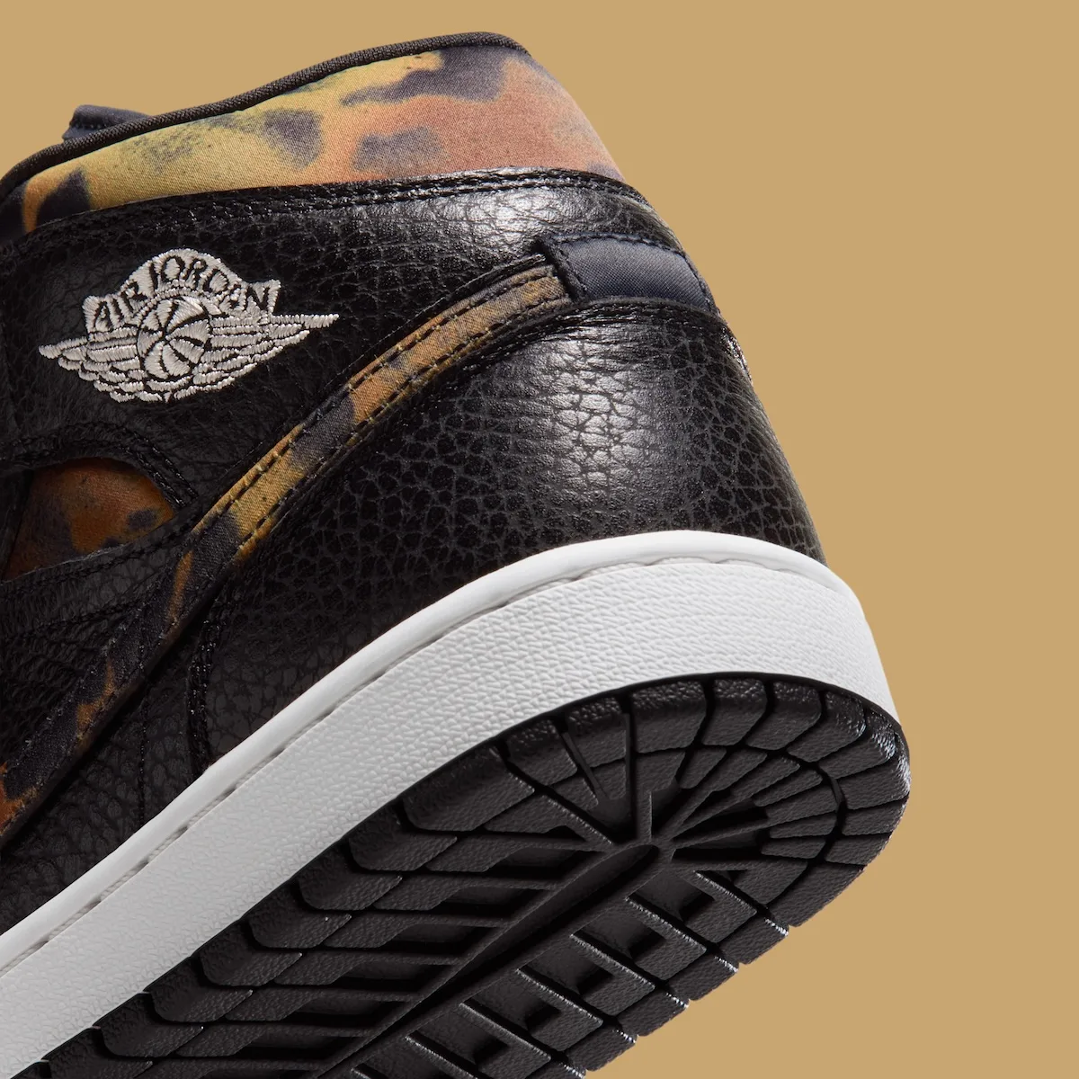 close-up heel detail, Air Jordan wings logo on black leather with leopard collar, Velvet Brown Leopard