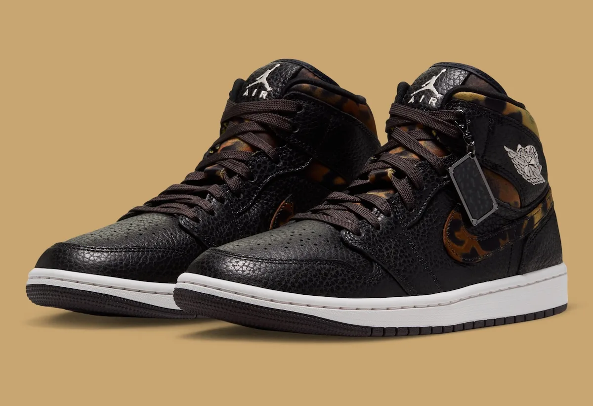 front three-quarter pair view showing leopard-print Swoosh and heel tabs, Velvet Brown Leopard