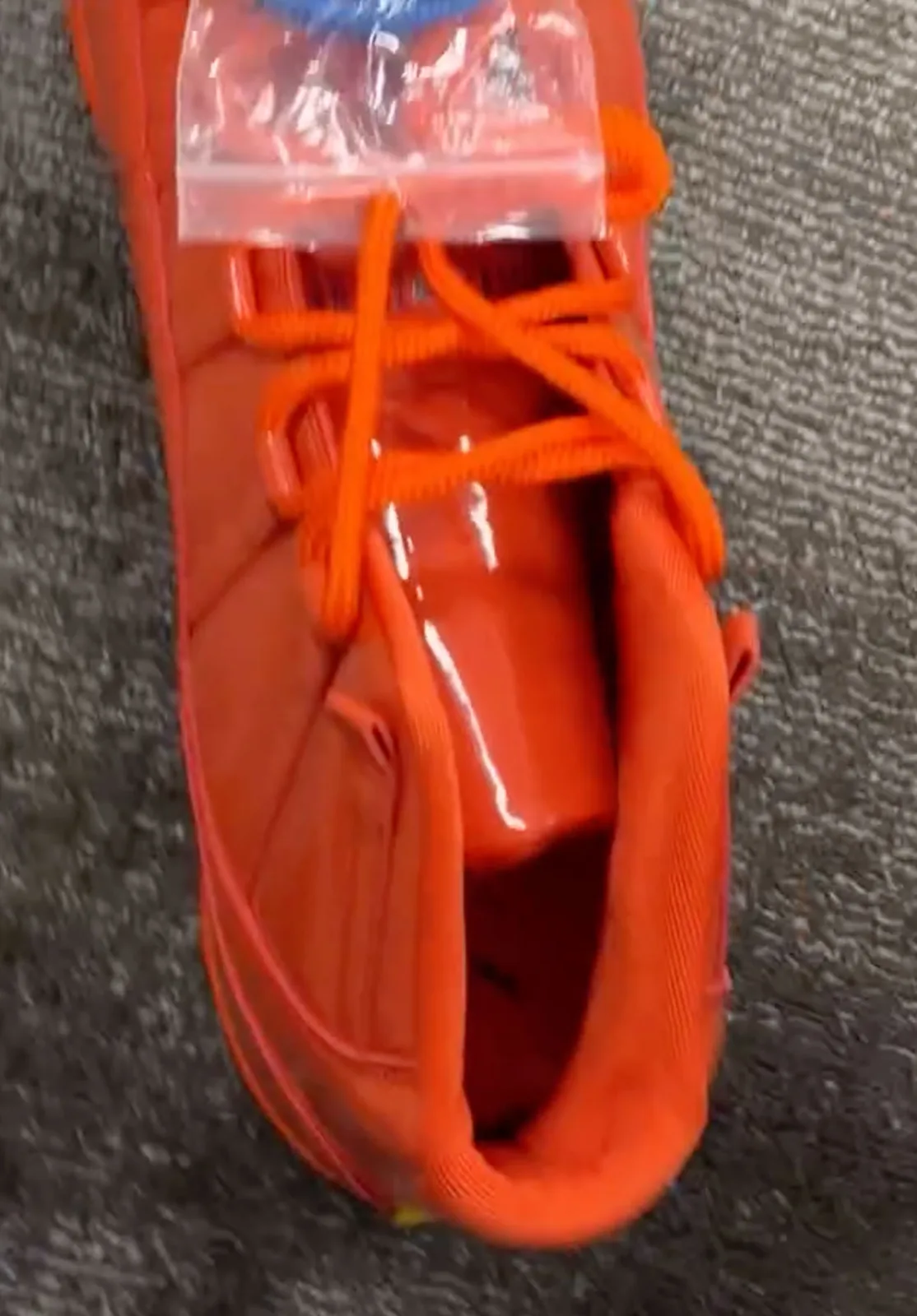 top-down throat view showing crossed orange laces and clear pull tab, Florida Gators