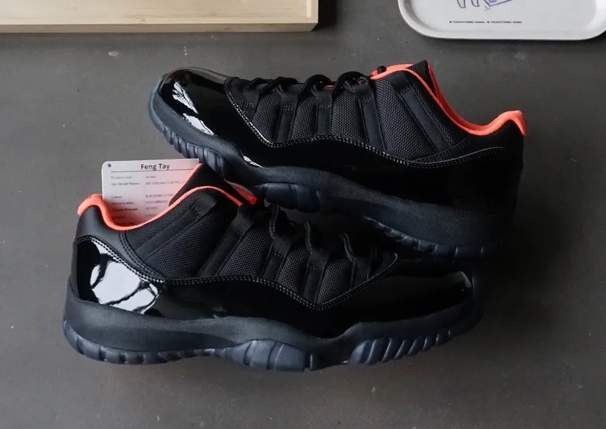 pair top-down on grey surface, black mesh and patent with coral collar, QC tag and box, Black Infrared