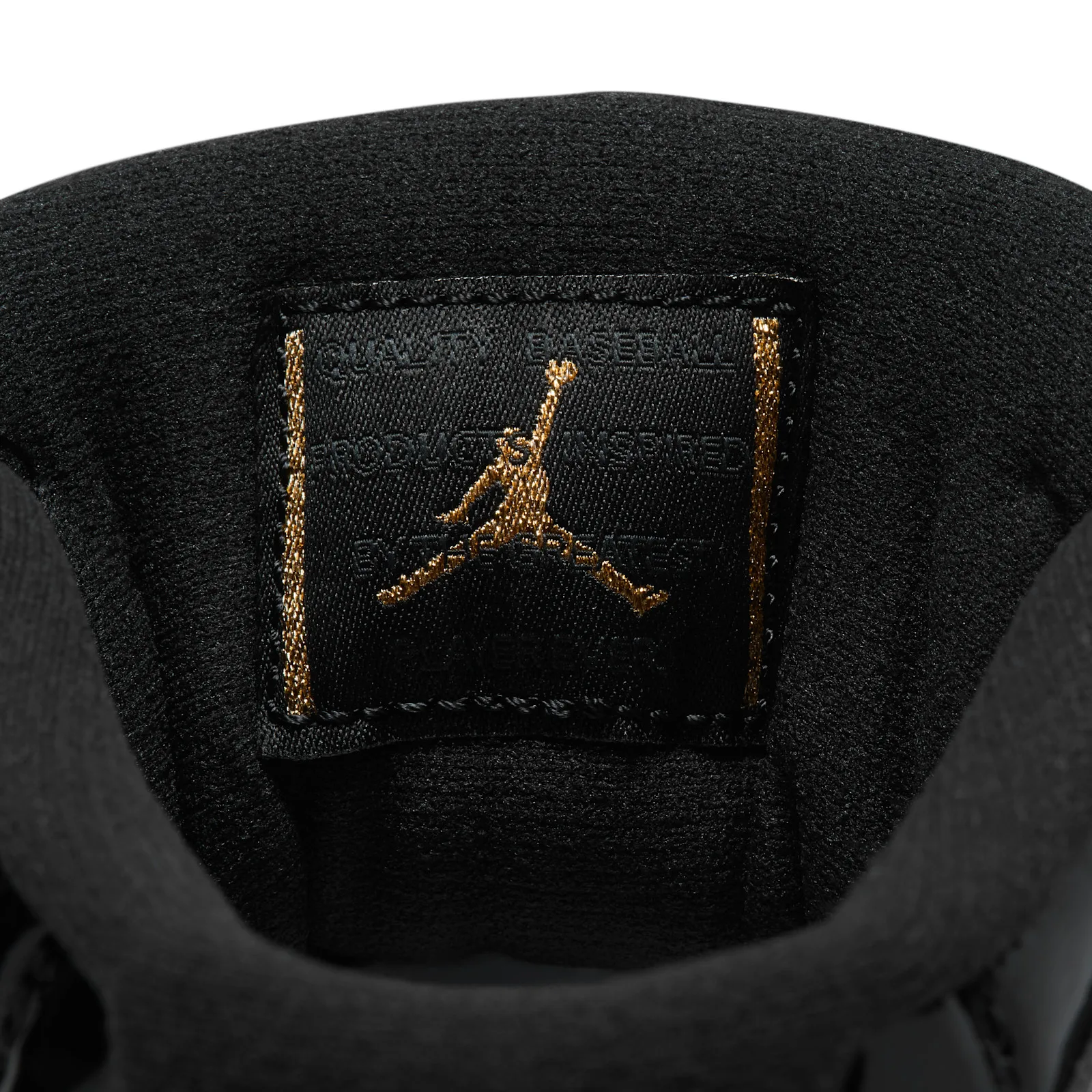 interior tongue detail with gold jumpman embroidery on black fabric, MCS Baseball Cleat