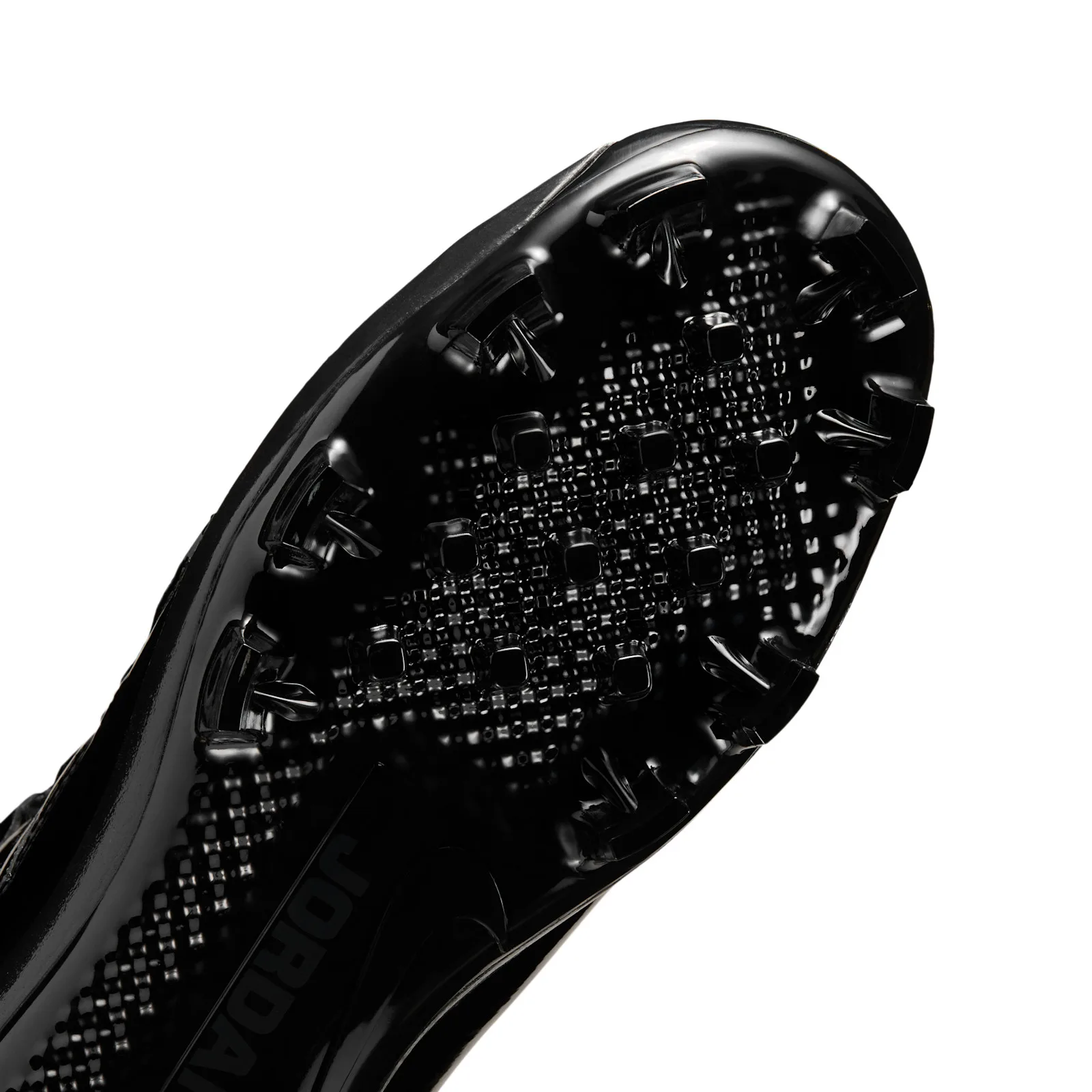 close-up of toe cleats and textured black traction pattern, MCS Baseball Cleat