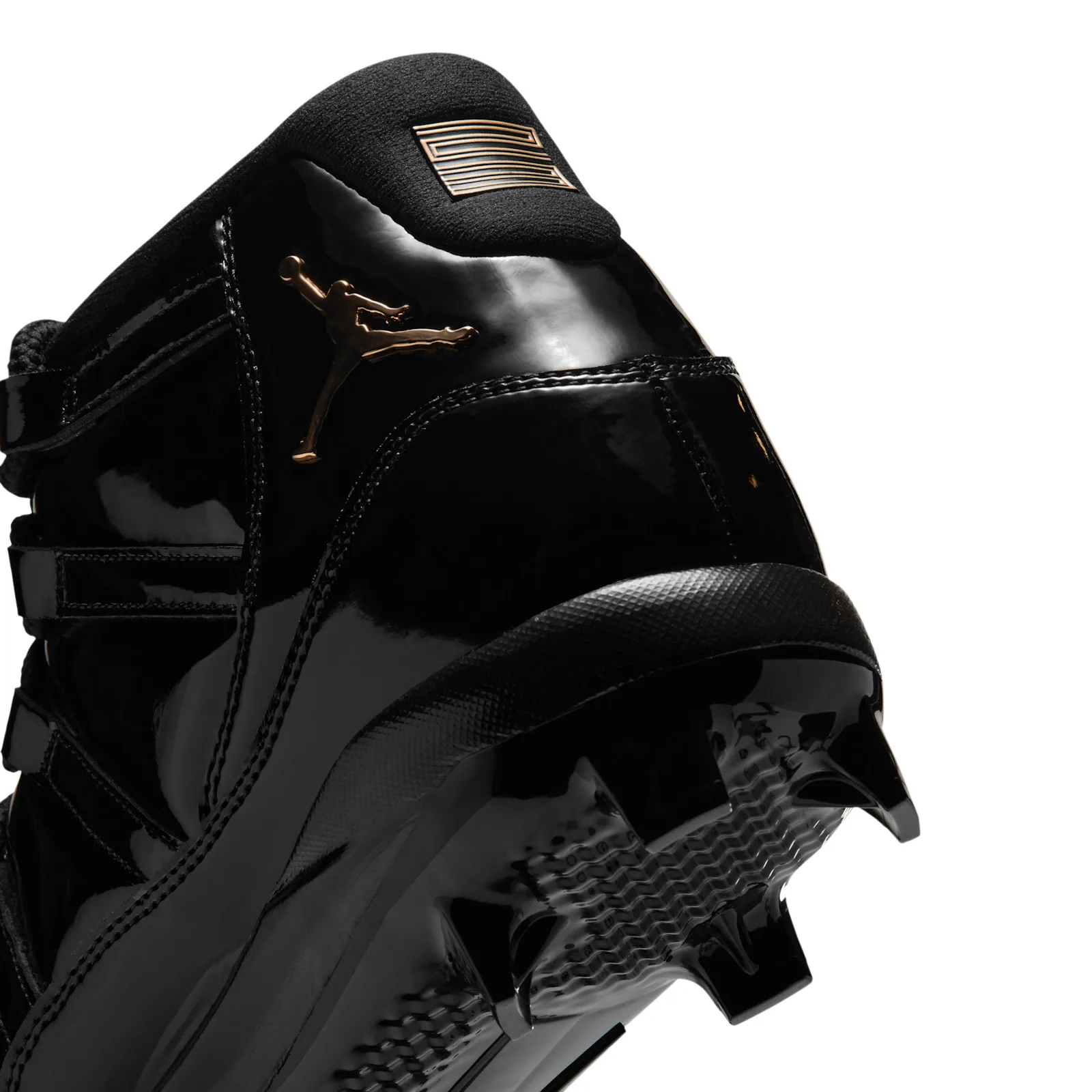 close-up heel detail with gold jumpman logo on patent leather, MCS Baseball Cleat