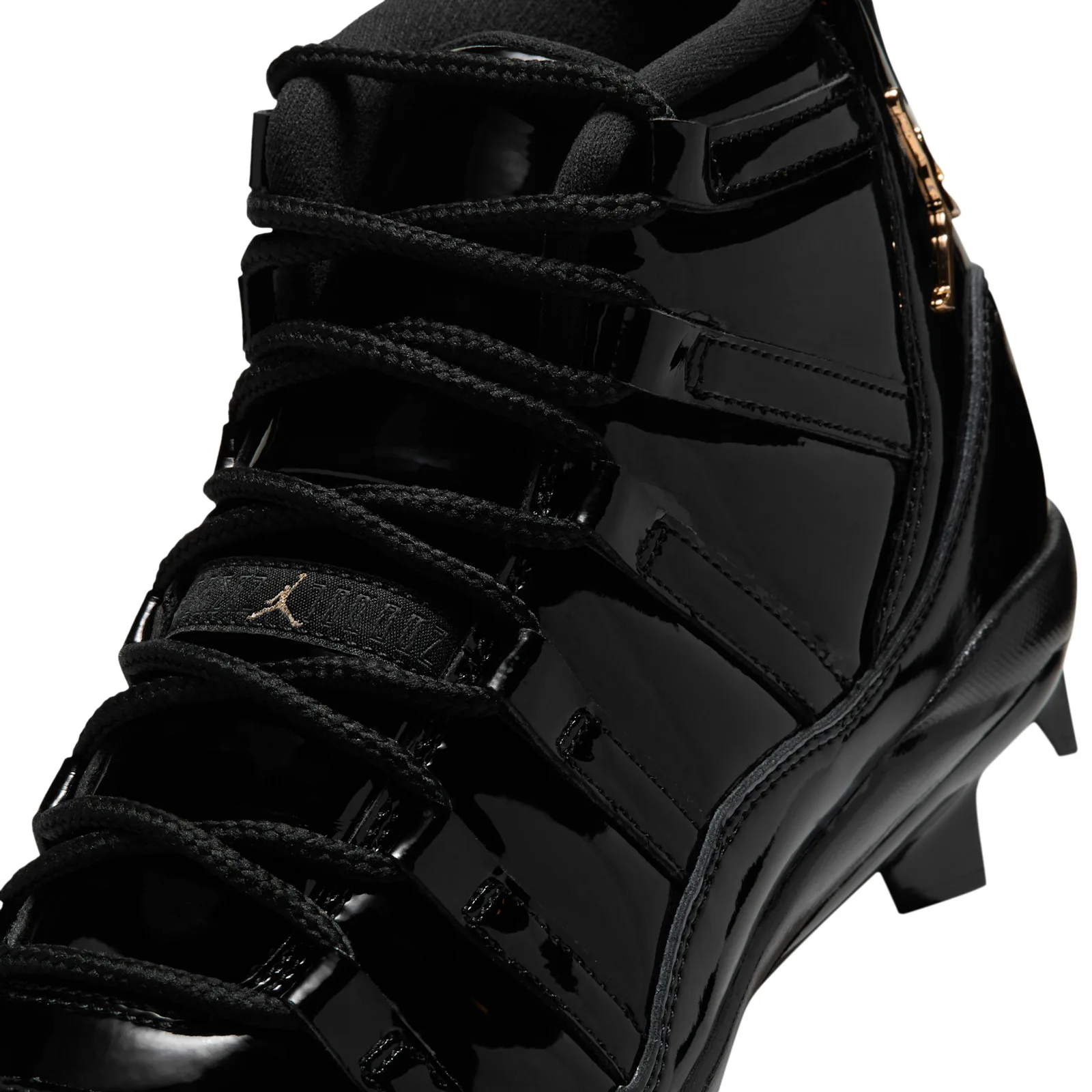 close-up of laces and strap with gold jumpman logo and zipper, MCS Baseball Cleat