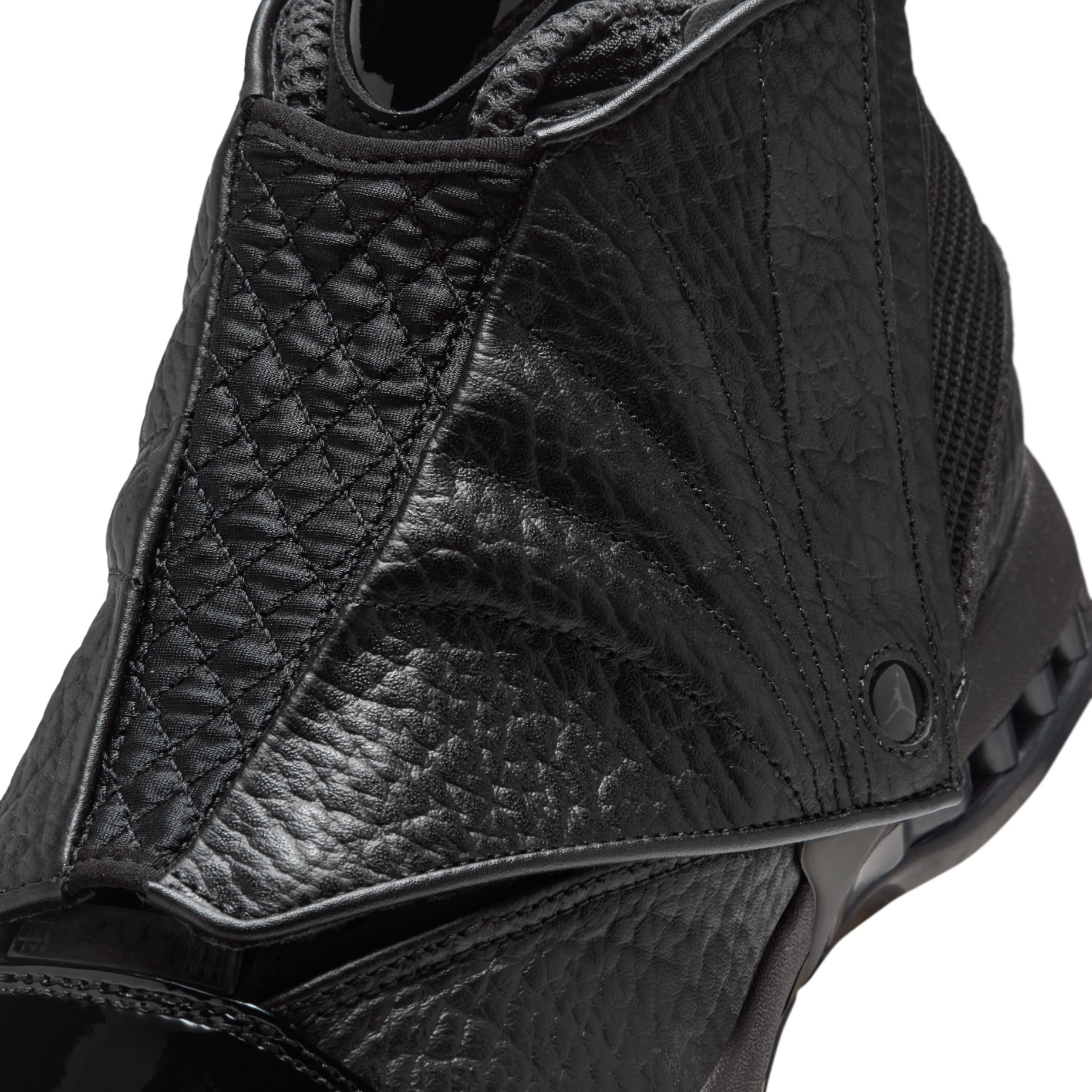 close-up medial forefoot, pebbled leather panels and Jumpman eyelet, Black Pack