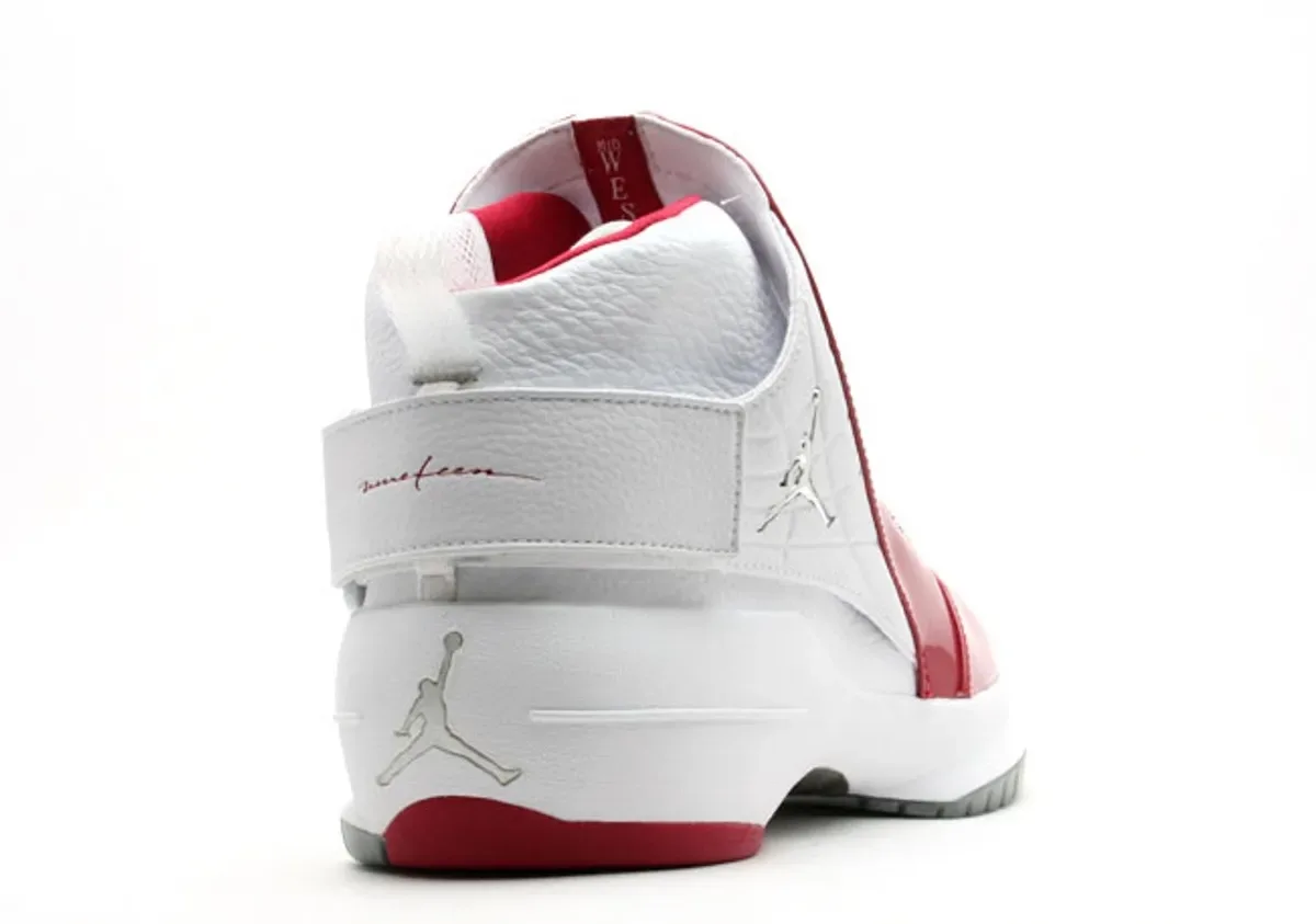heel-medial view, white leather, red 'nineteen' script, silver Jumpman on heel, Midwest