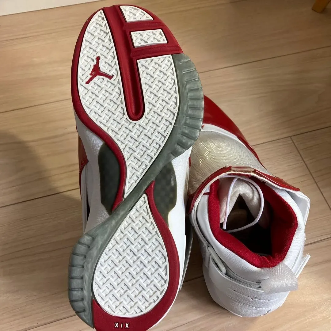 outsole and heel angled shot, red and white tread pattern with 'XIX' text, Midwest