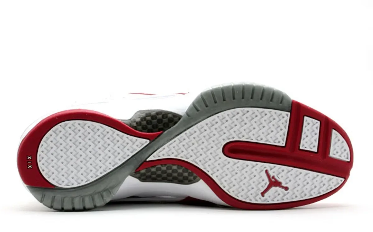 outsole view, white and grey herringbone tread with red trim and Jumpman logo, Midwest