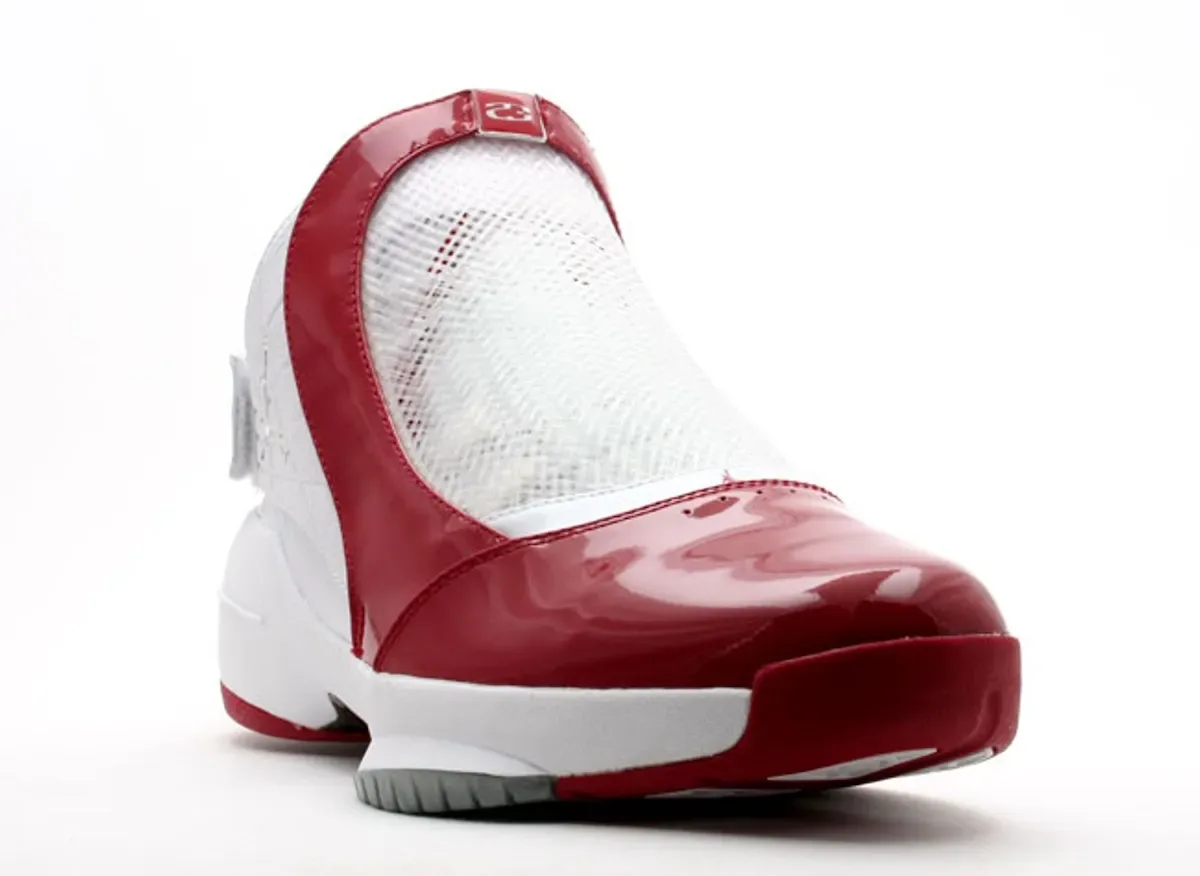 angled toe view, glossy red patent toe box, white mesh tongue, red 23 tab, Midwest