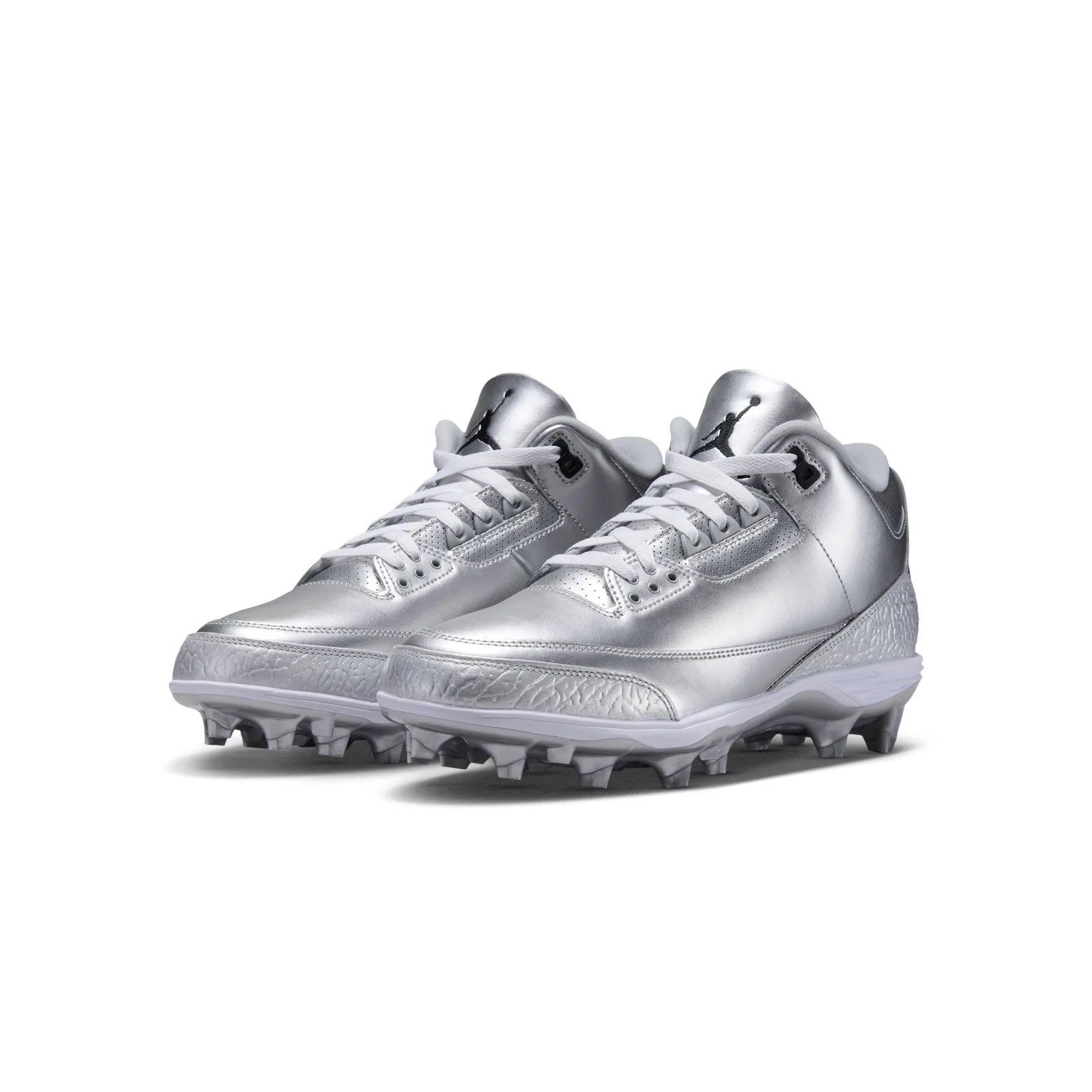 front three-quarter view of pair with white laces and cleated soles, Metallic Silver