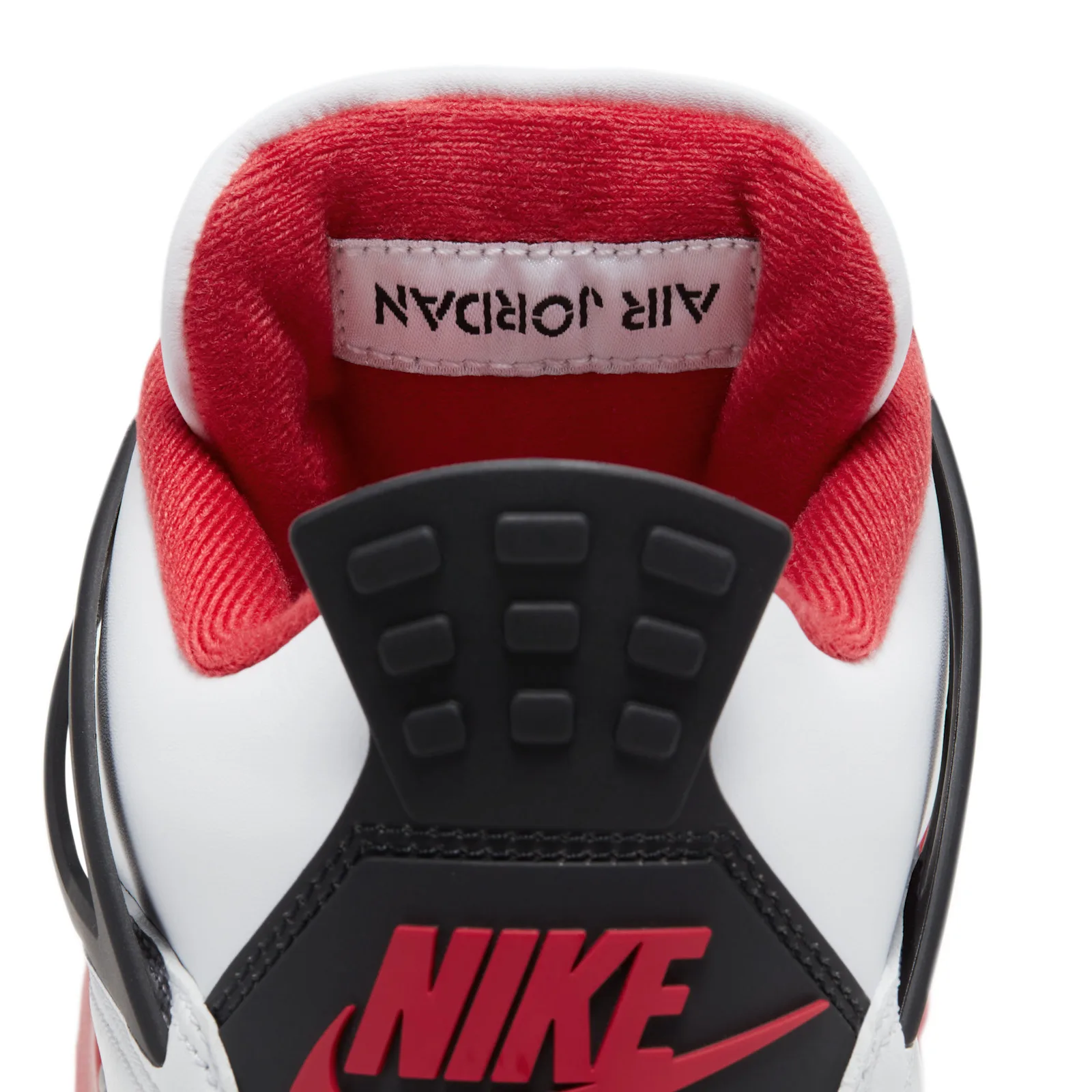 heel collar close-up with mirrored 'AIR JORDAN' tag and black pull loop, Fire Red