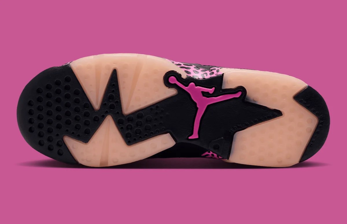 outsole view with black traction pads, pale pink sole and pink Jumpman logo, Jordan 6 Low