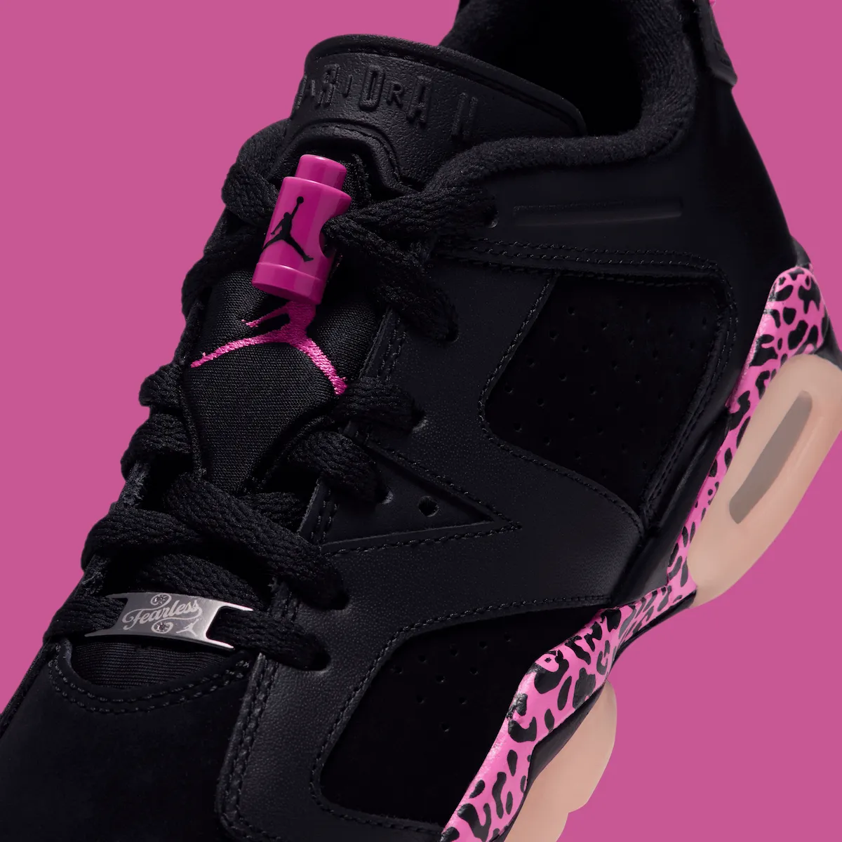 close-up of tongue with pink lace lock, Jumpman branding and leopard heel panel, Jordan 6 Low