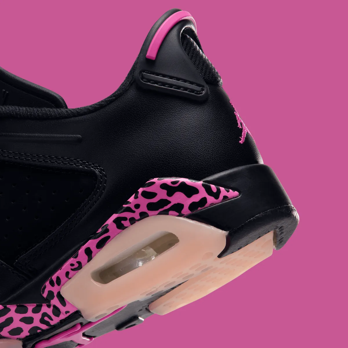 close-up of heel showing pink trim, embroidered Jumpman and leopard print overlay, Jordan 6 Low