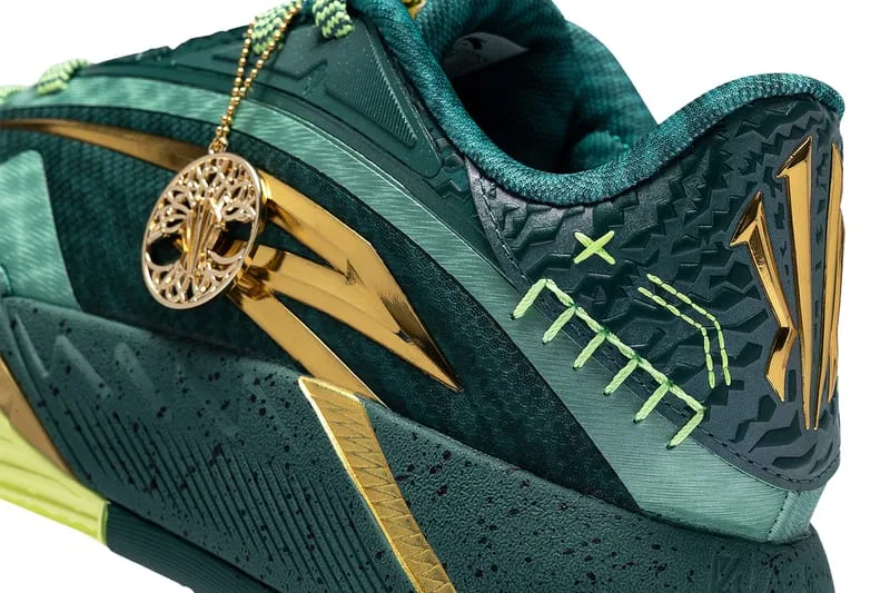 heel detail, gold KAI branding, green stitched pattern and tree charm, Alchemist