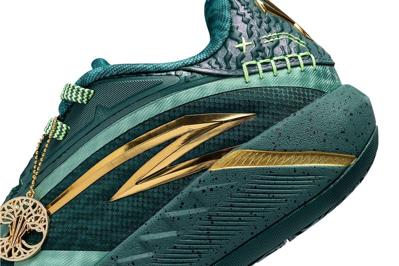 forefoot detail, gold swoosh stripes over dark green speckled sole, Alchemist