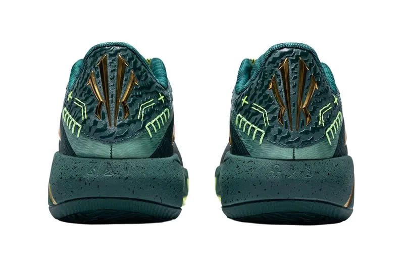 heel view of pair, gold KAI logo on dark green speckled midsole, Alchemist