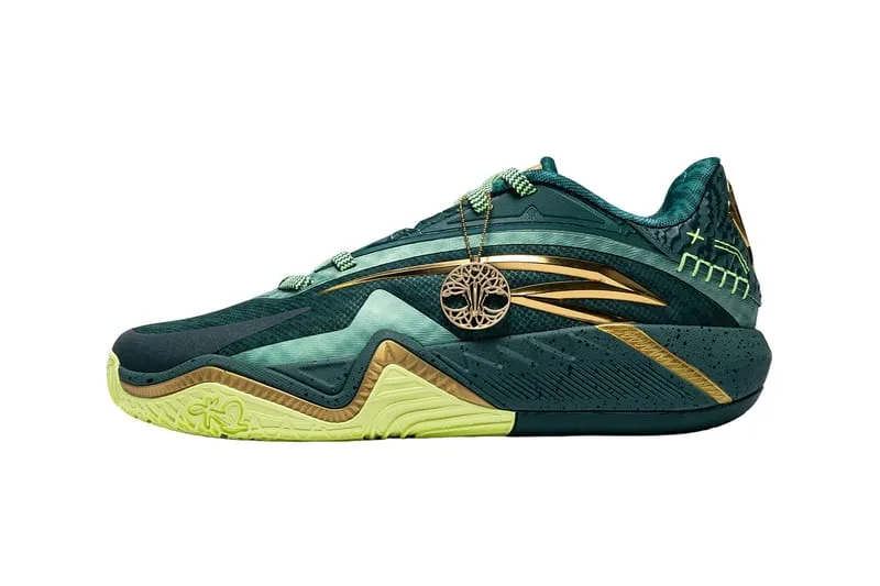 lateral view, dark green shoe with gold swoosh accents and dangling charm, Alchemist