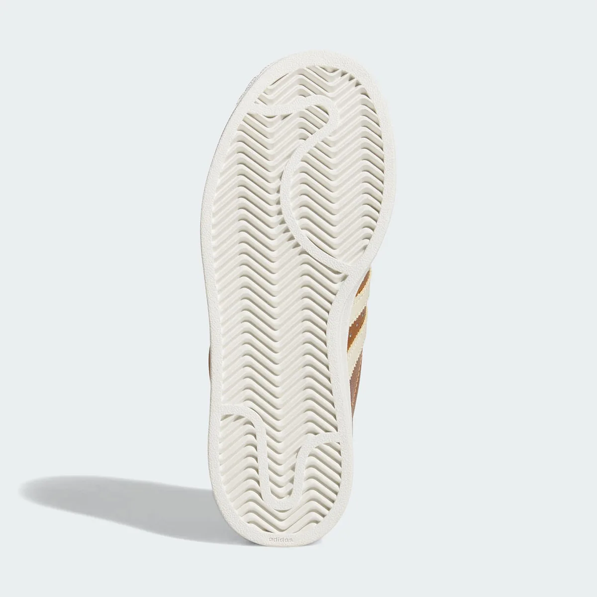 outsole view showing herringbone tread pattern and adidas wordmark, Metallic Gold