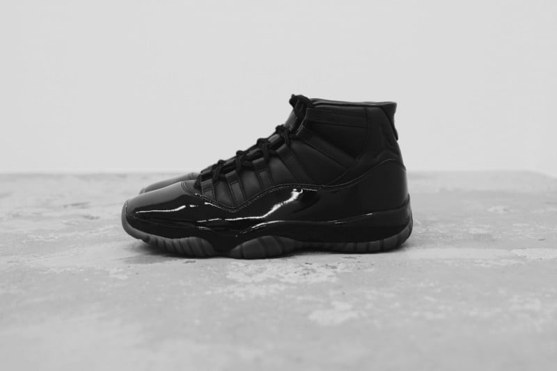 Side profile showing black patent toe box and black ankle collar, Air Jordan 11