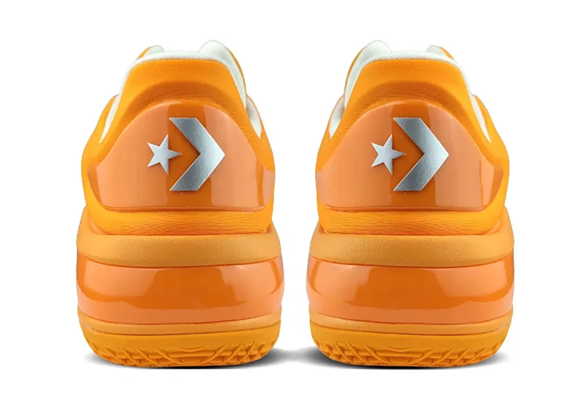 heel view of pair, orange patent heel counters with silver star-chevron logo, Creamsicle