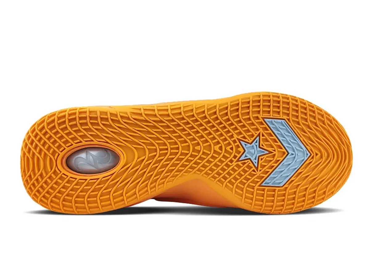 outsole view, orange tread with light blue star-chevron logo and pale heel emblem, Creamsicle