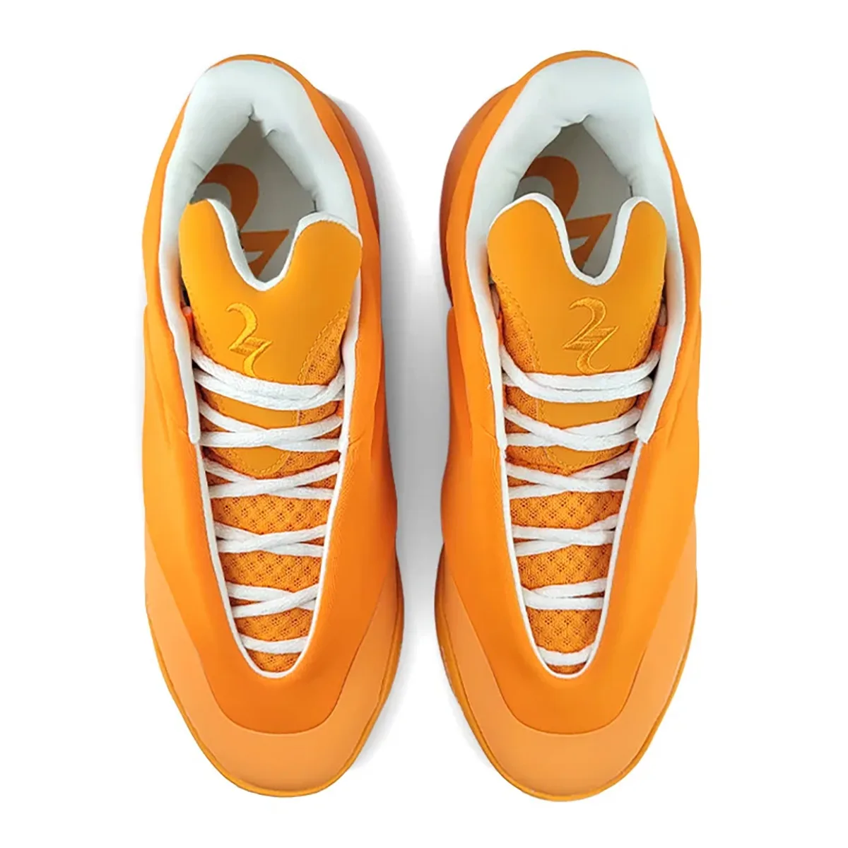 top-down view of pair, orange uppers with white laces and embroidered numeral on tongue, Creamsicle