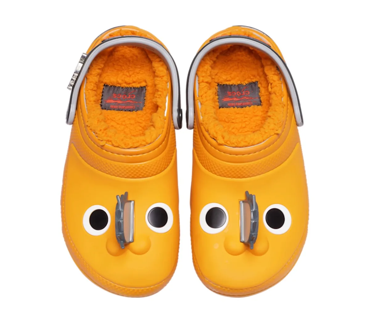 top-down pair, yellow clogs styled with cartoon eyes and nose, Classic Clog Collection