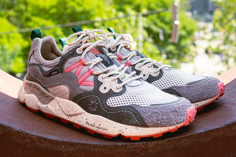 pair on concrete ledge, green foliage backdrop, cream laces and red outsole, Staple Yamano 3