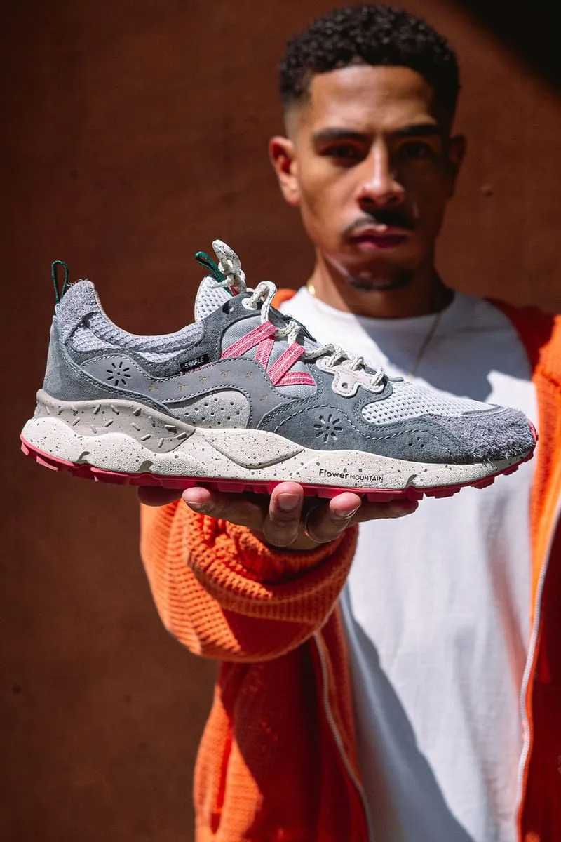 lateral view held in hand, grey suede toe, red outsole, Flower Mountain text, Staple Yamano 3