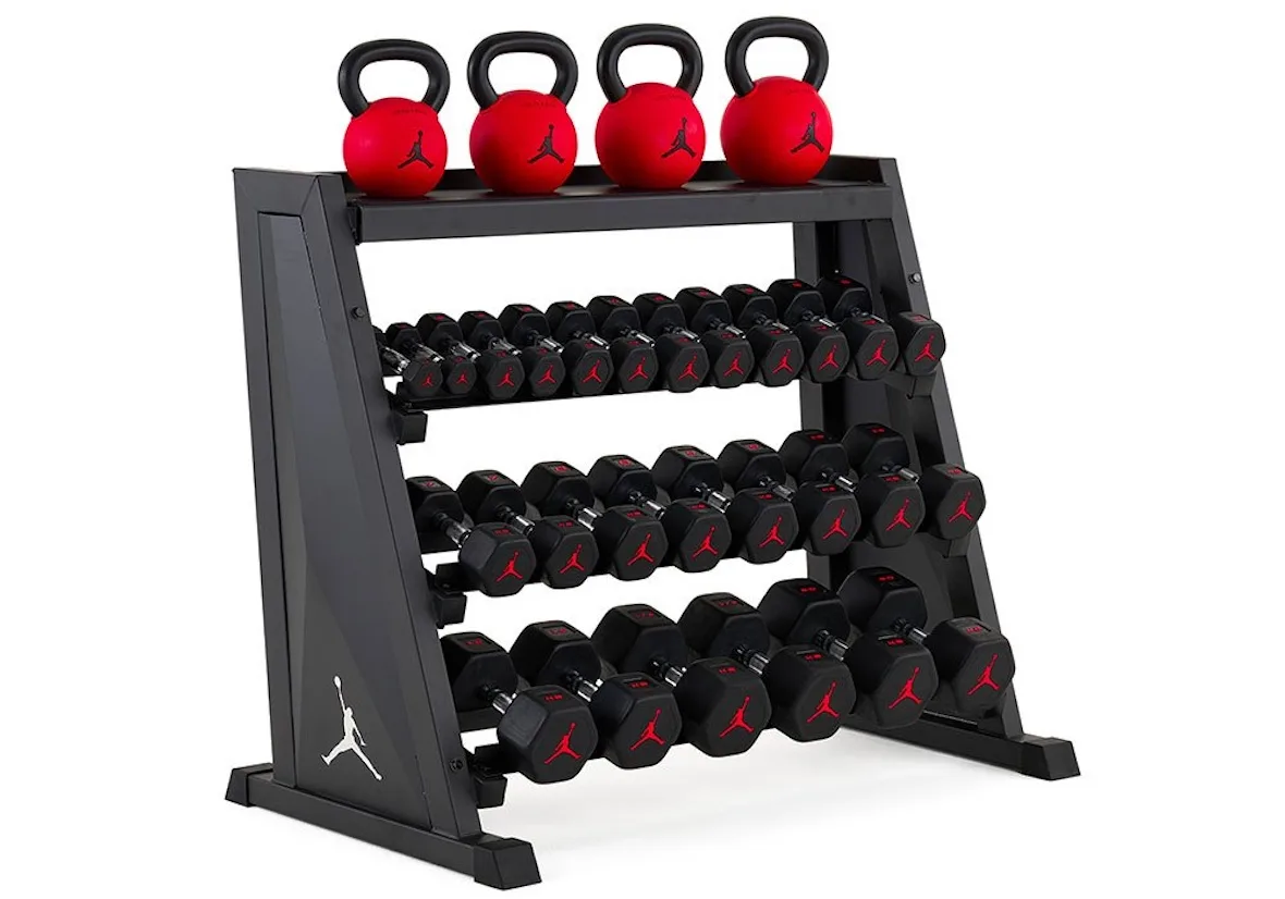 loaded black A-frame dumbbell rack with kettlebells on top and Jumpman logo, Jordan Strength Collection