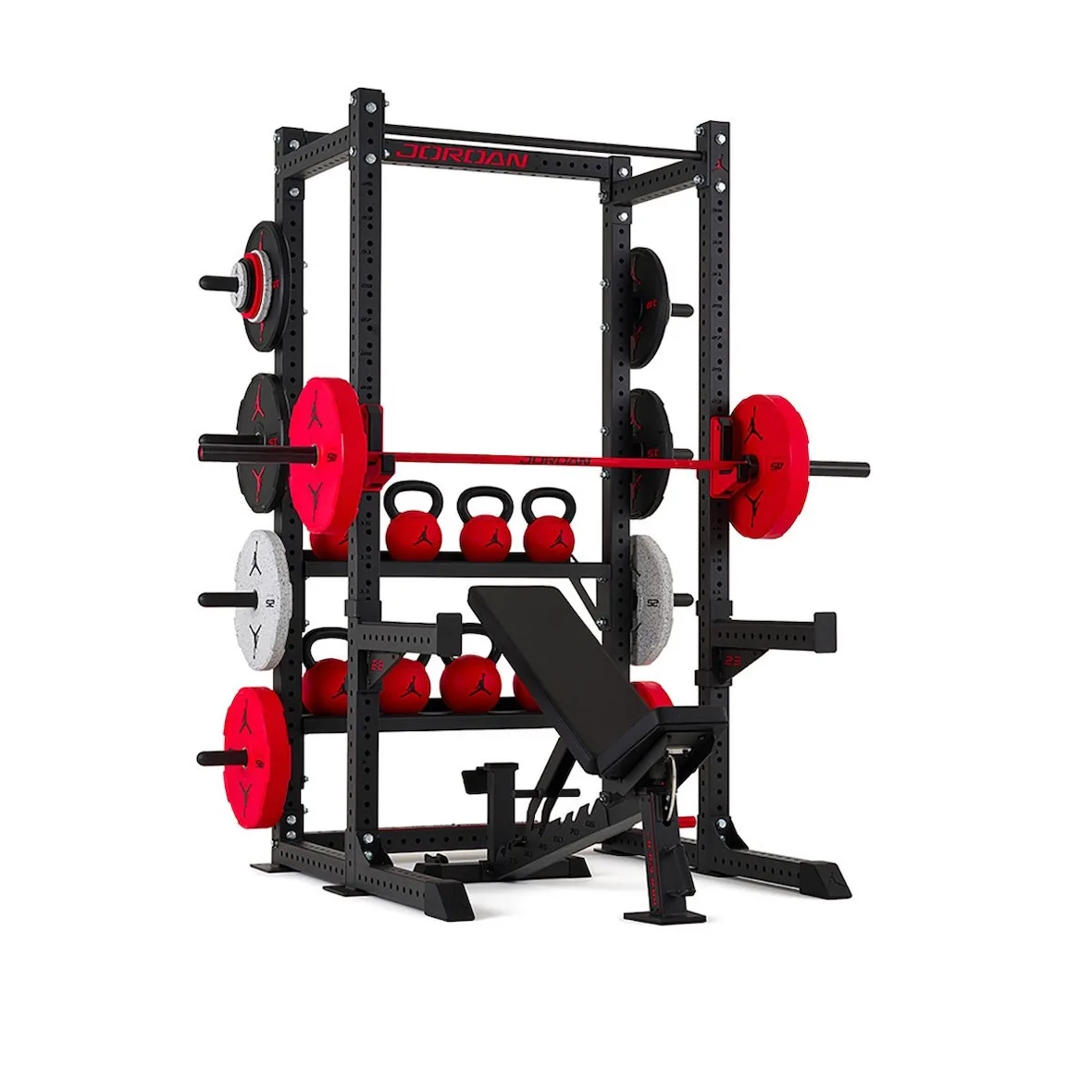 loaded black power rack with red Jordan branding, plates, kettlebells and bench, Jordan Strength Collection