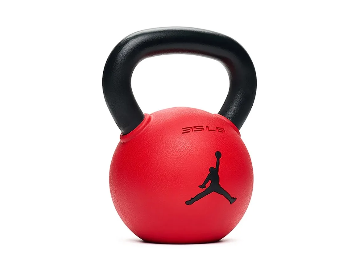 front view of red kettlebell with black handle and Jumpman logo, Jordan Strength Collection