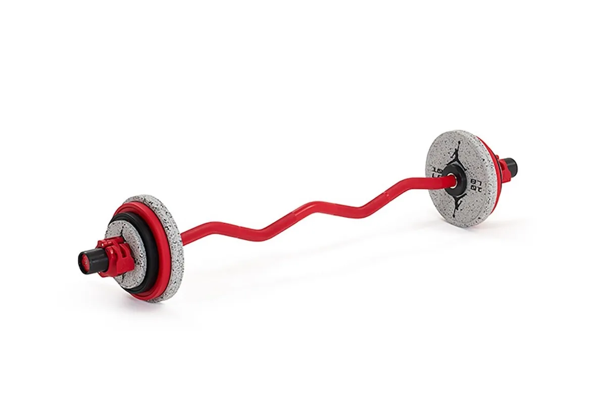 red curved EZ bar with speckled grey plates and Jumpman logo, Jordan Strength Collection