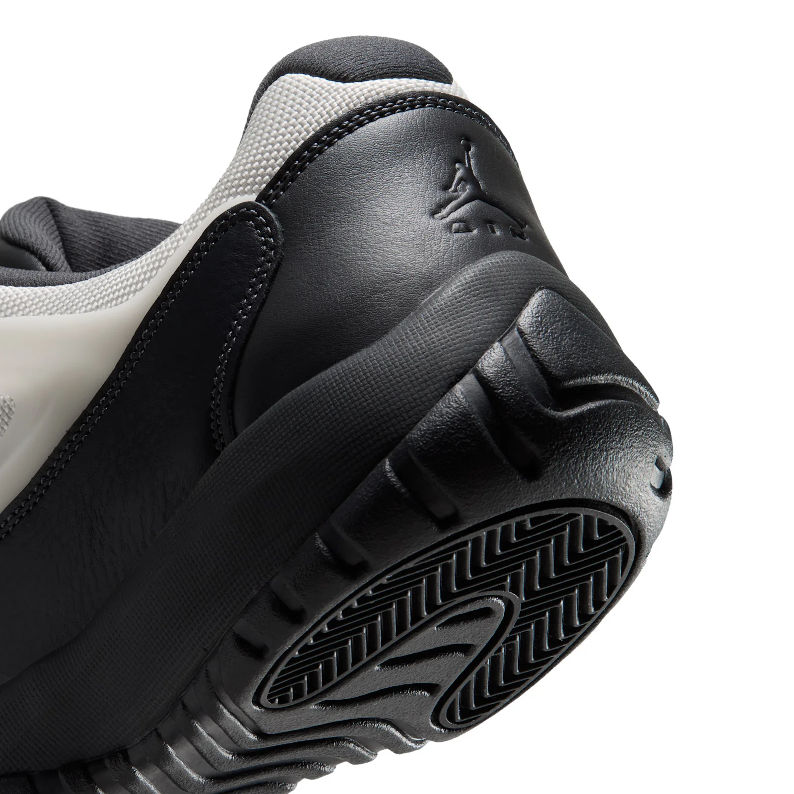 close-up of black heel counter with embossed Jumpman logo and tread, Sail/Black