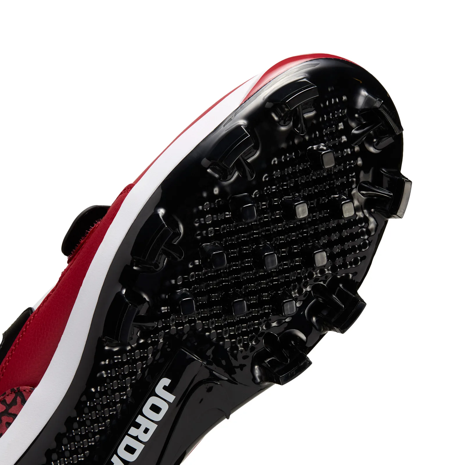 angled outsole close-up showing black cleats and Jordan text molded in, Chicago