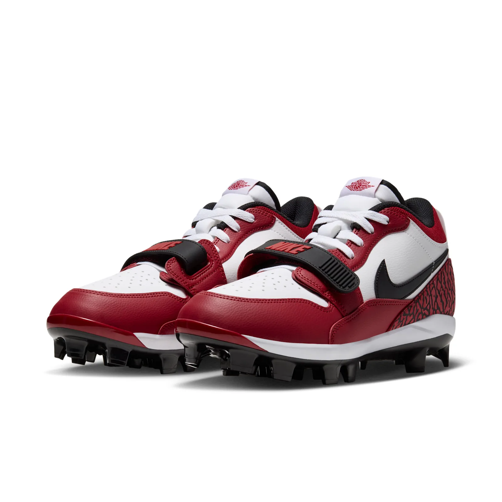 front three-quarter pair view showing red and white uppers, black straps with NIKE text, Chicago