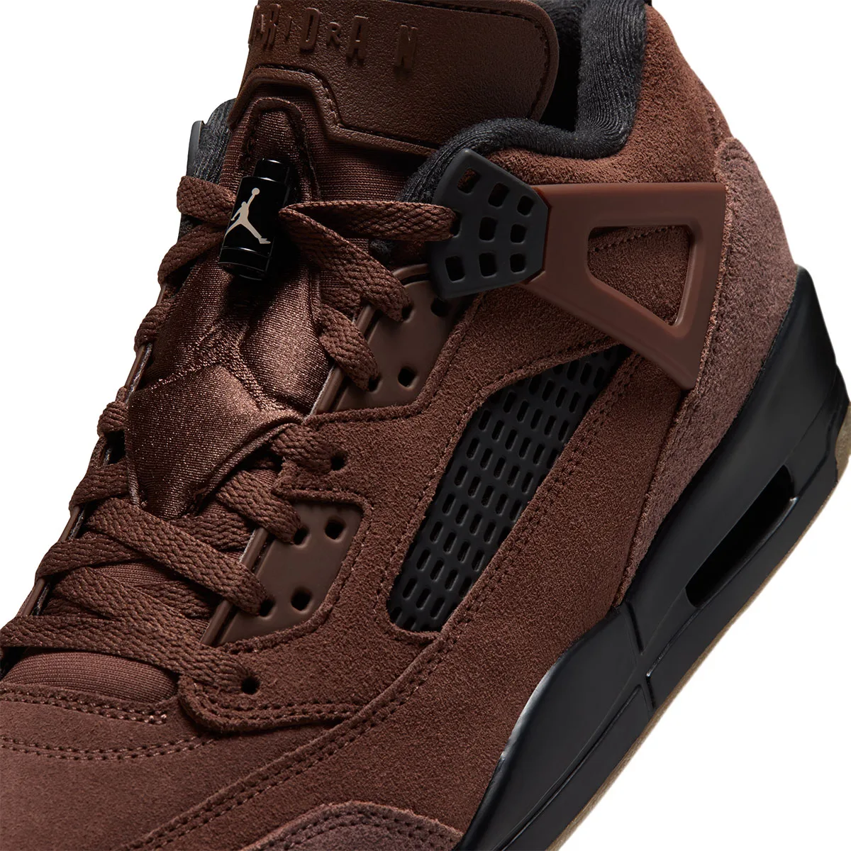 close-up of lace toggle and eyestay, brown suede with black mesh panel, ike Low “Fauna Brown