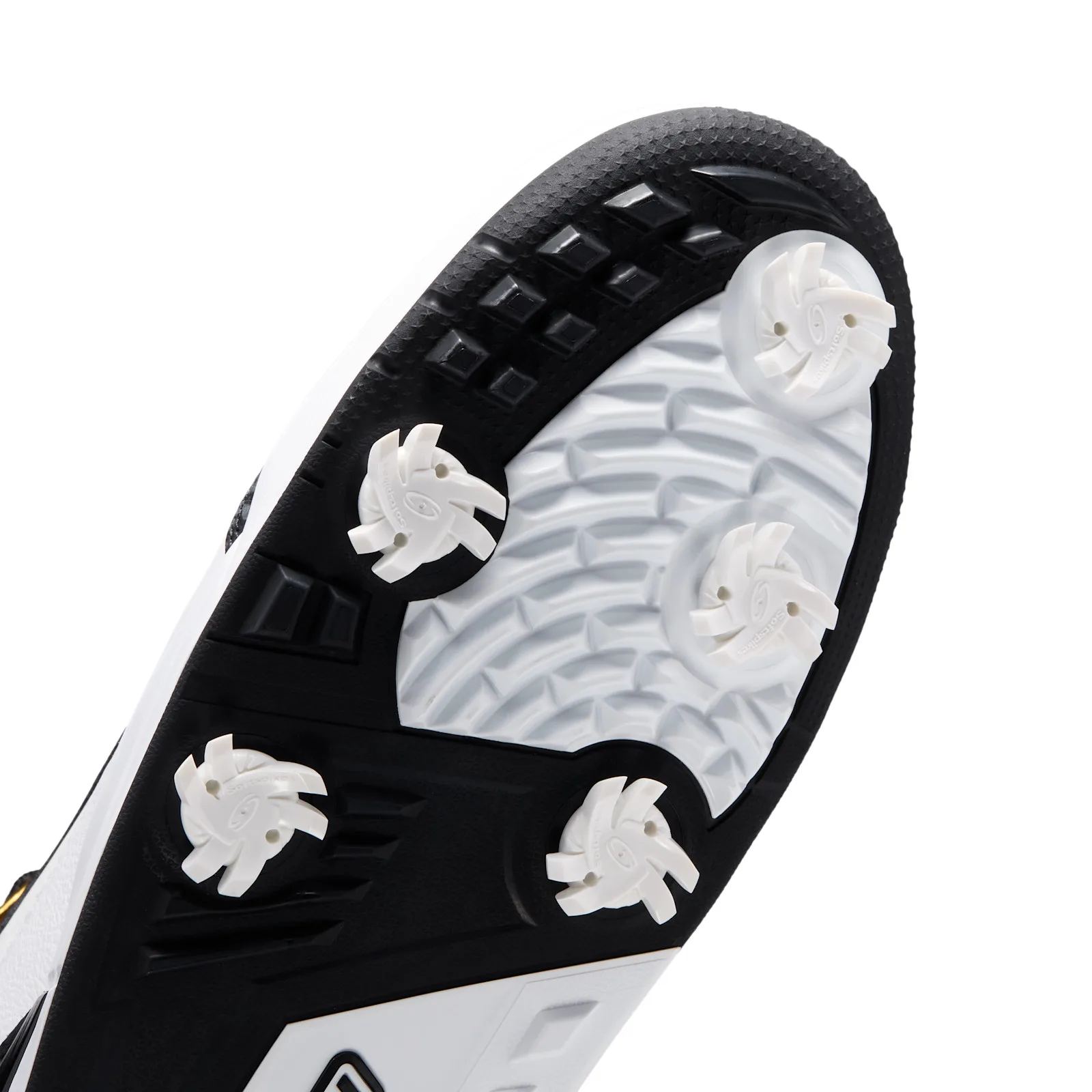 angled close-up of toe spikes, white cleats on black and white textured outsole, DMP