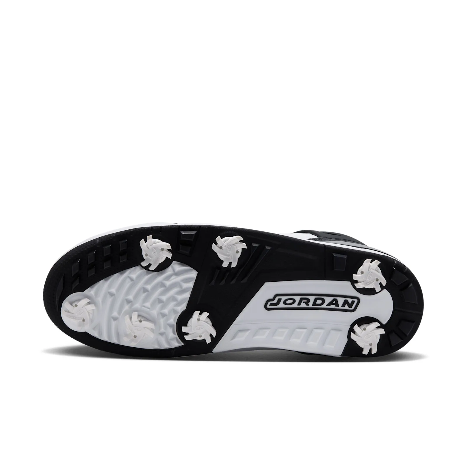 outsole close-up, white removable golf spikes set in black and white sole, DMP