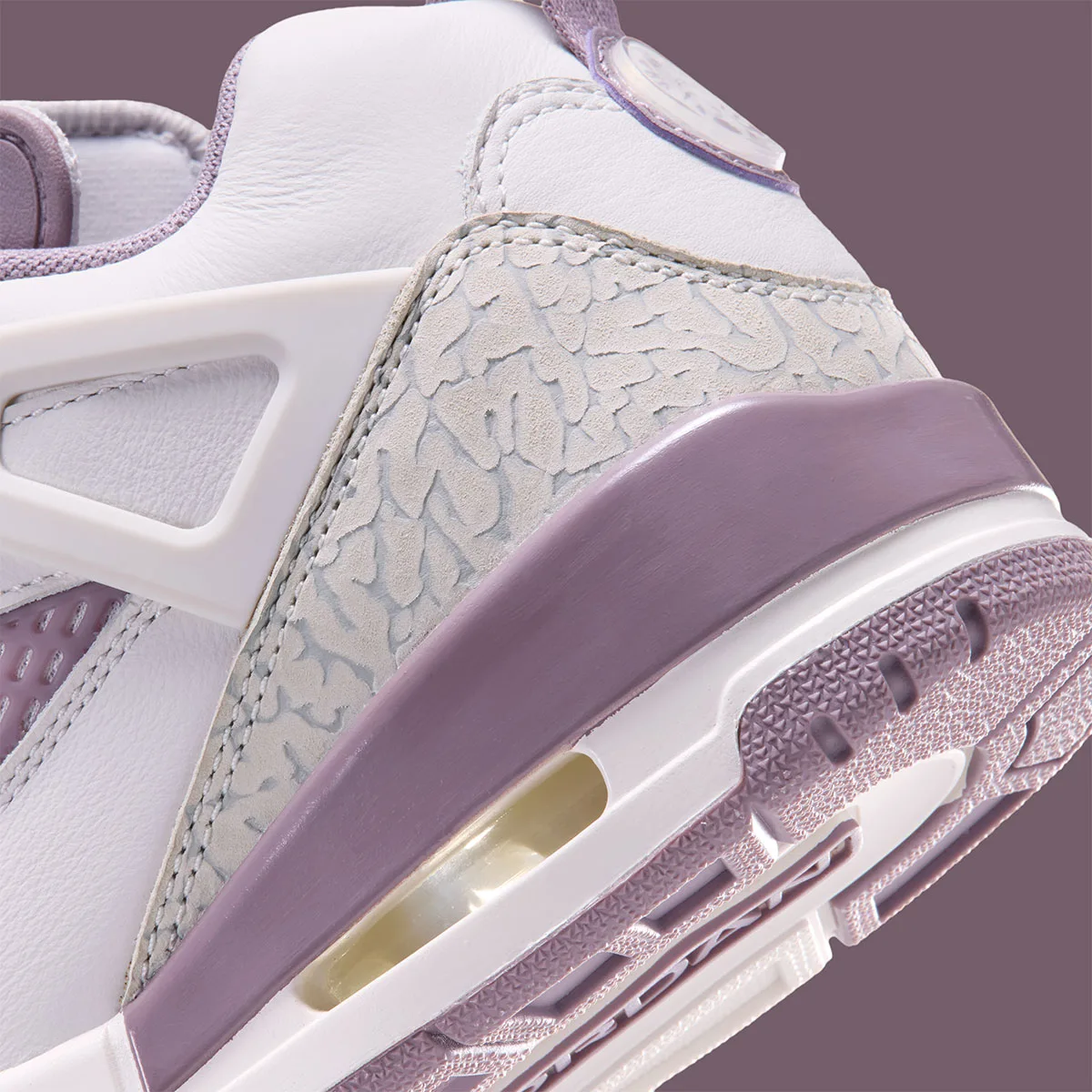 Heel detail close-up with elephant print, Air unit and mauve wrap, Swan