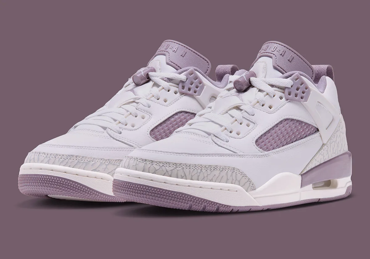 Pair shown at angle, white uppers with lavender mesh and elephant print, Swan