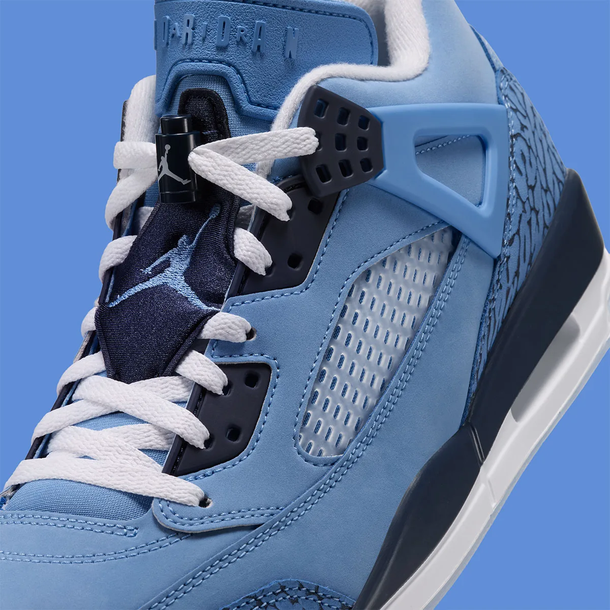 close-up detail of lace area, jumpman lace lock and navy mesh eyelet panel, UNC