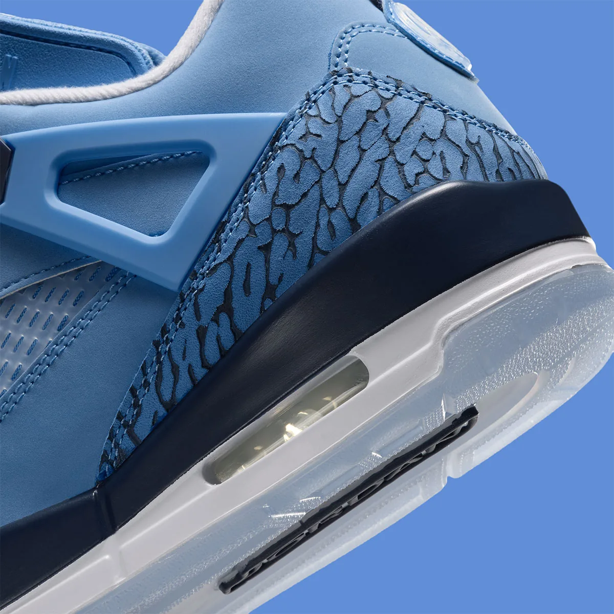 close-up detail of heel elephant print texture and navy midsole with visible air unit, UNC