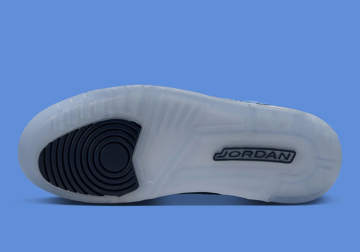 outsole view, translucent icy sole with navy jordan logo and circular heel pattern, UNC