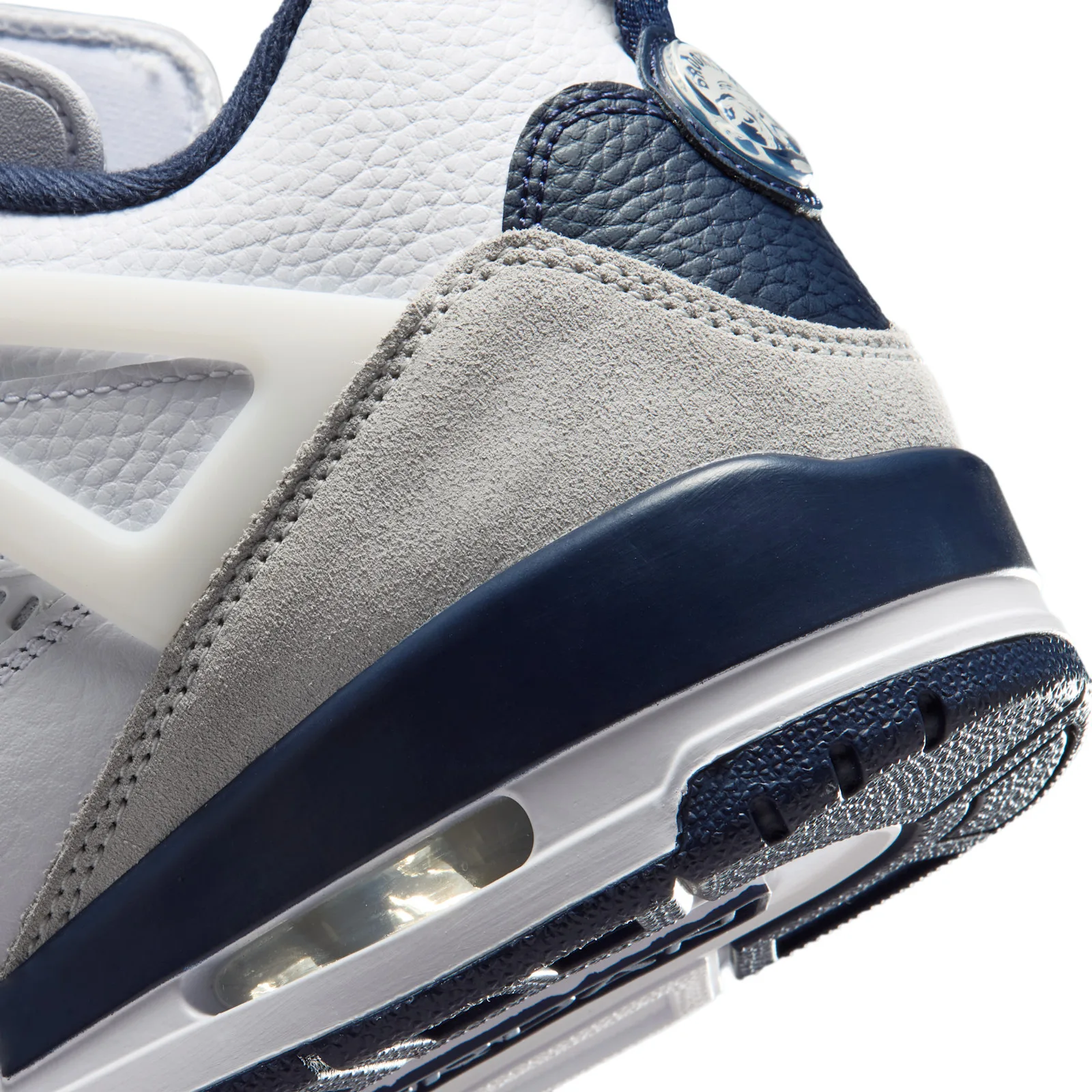 close-up of heel and midsole, grey suede panel, navy trim and visible Air unit, Grey Fog