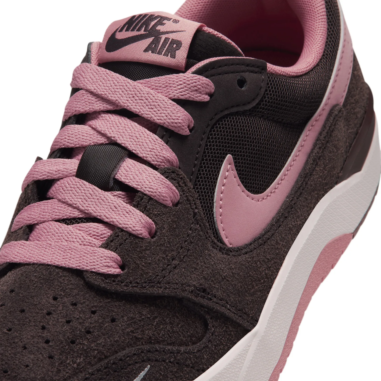 Close-up toe, pink swoosh and Nike Air tongue tag on black mesh, Jordan Strada