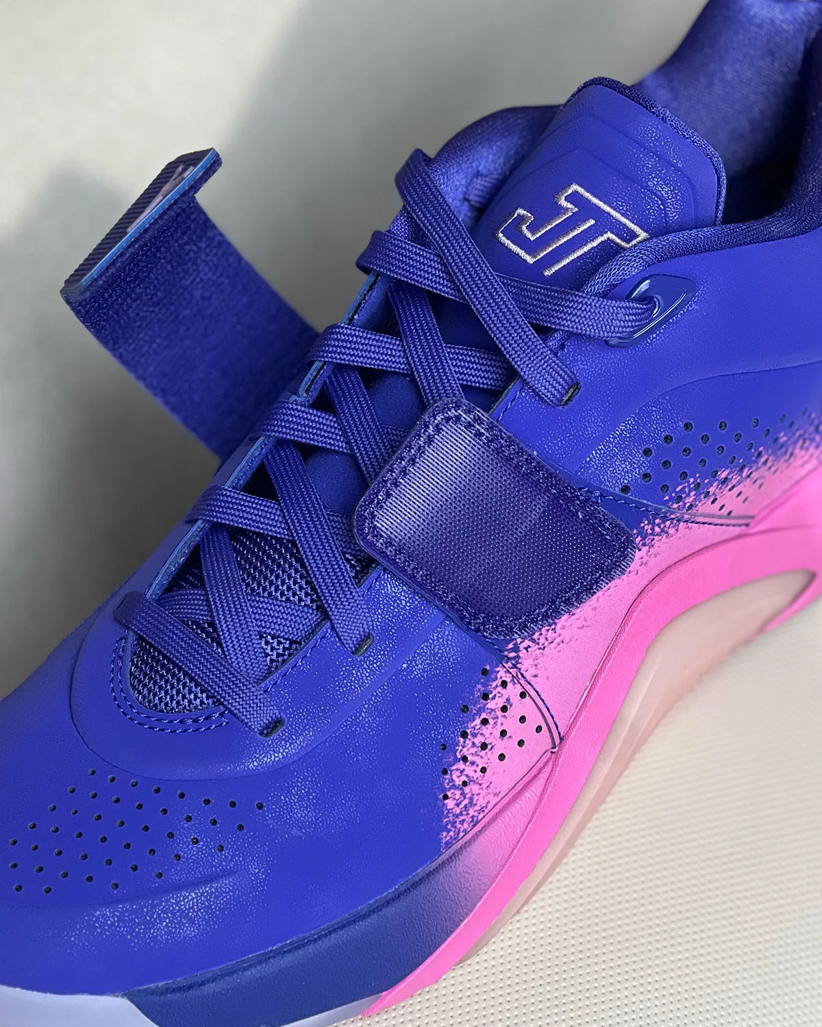 Toe and lace close-up, purple upper with silver JT embroidered logo, Jordan Tatum 5