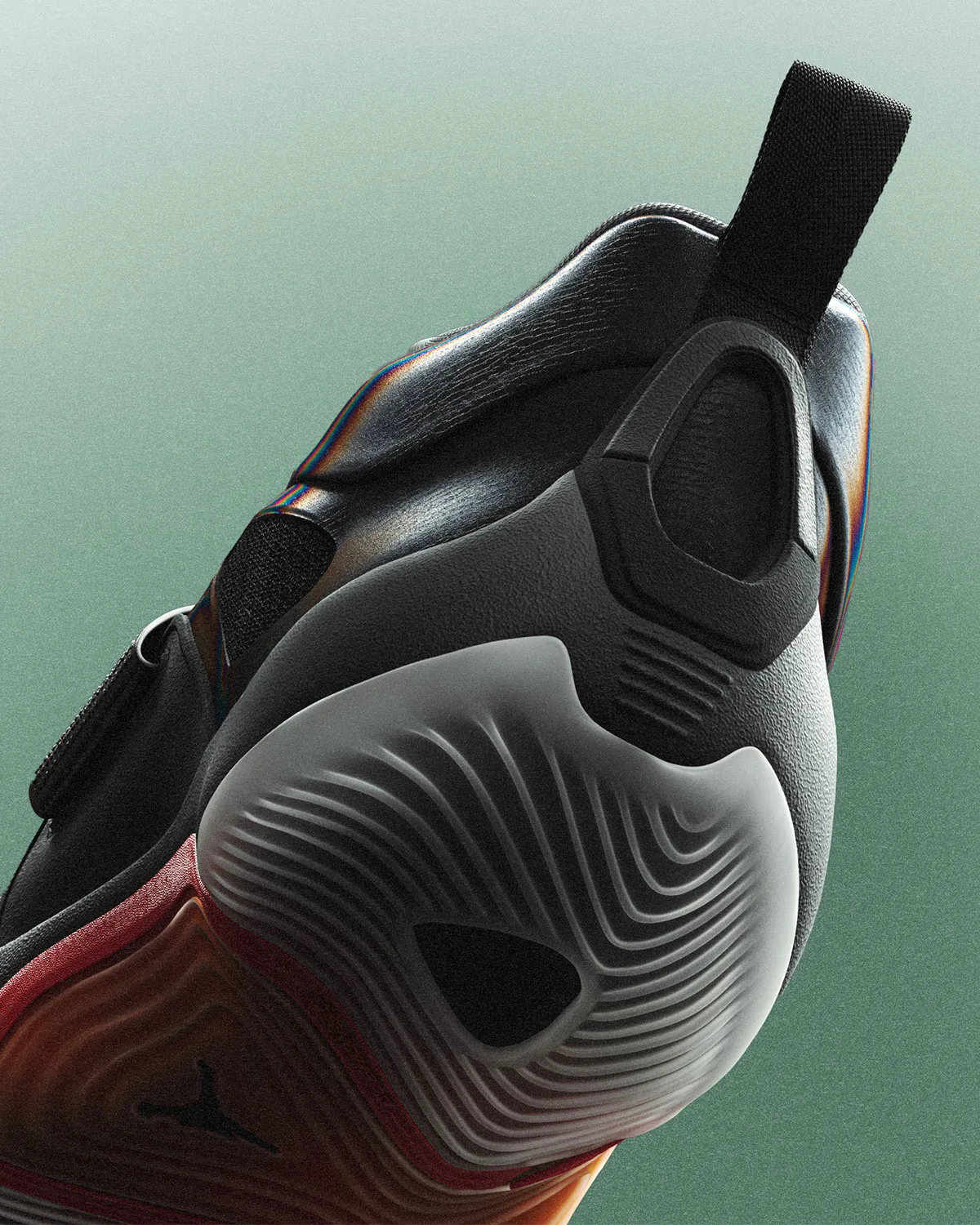 Heel close-up, black textured counter with pull tab and orange midsole, Jordan Tatum 5